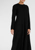 Cut in an A line silhouette with a round neck collar & semi fitted sleeves. Features a concealed zip fastening at the back for easy access. Black