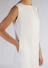 Our signature slip is made from a fluid viscose fabric featuring a slightly scooped neckline. This slip is ideal to pair with our selection of kimonos or wear as an undergarment. White.