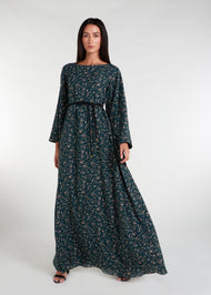 The Kew Maxi Dress is a lightweight and flowy maxi dress, complete with bell sleeves. Its vibrant green color and delicate floral print make it the perfect choice for a breezy summer day. 