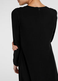 Cut in an A line silhouette with a round neck collar & semi fitted sleeves. Features a concealed zip fastening at the back for easy access. Black