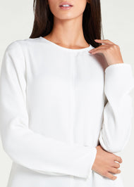  Long Line Abaya in Classic White, featuring a flattering silhouette that effortlessly complements your style. Experience comfort and sophistication in every step with this must-have addition to your modest collection.