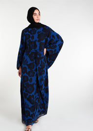 Elevate your evening and garden party attire with the striking Midnight Rose Kaftan, featuring a bold black and blue rose print. Designed with fully lined, dramatic pointed wide sleeves, this kaftan is perfect for special occasions. 