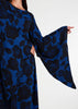 Elevate your evening and garden party attire with the striking Midnight Rose Kaftan, featuring a bold black and blue rose print. Designed with fully lined, dramatic pointed wide sleeves, this kaftan is perfect for special occasions.&nbsp;