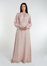 The Pleated Bodice Maxi in Neutral features a safari-inspired print and is crafted from a lightweight, fully lined fabric for a modest yet stylish summer look. With a lightly pleated bodice at the waist, this maxi offers the illusion of a top and skirt, making it suitable for both casual and formal occasions. 