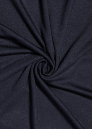 Effortless to style and incredibly comfortable to wear, with a subtle sheen. The medium-thick weight is soft, breathable, fully opaque and durable. Jersey works well in all climates, can be worn without an under scarf or pins, and makes a great option for working out. Navy blue. 