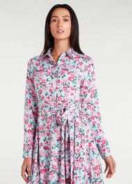 Featuring a vibrant floral pattern with an optional belt for styling, standard collars, discreet side pockets, and buttons all the way down, this maxi dress is perfect for any occasion. It is also suitable for nursing, making it a practical and stylish choice for any mother. Light blue base colour with pink roses and green thorns and leaves.