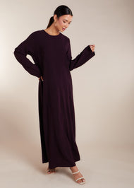 This elegant Two Piece Open Abaya set includes a Full Sleeve matching inner dress. Perfect for everyday wear, it can also be dressed up with accessories for an evening look. The open abaya can be worn as a maxi on its own or paired with the inner dress for a stylish ensemble. In a deep plum purple shade.